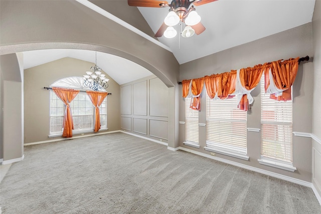 2806 Glenwick Ct, Richardson, TX 75082 - empty room with vaulted ceiling, arched walkways, a ceiling fan, carpet, and a chandelier