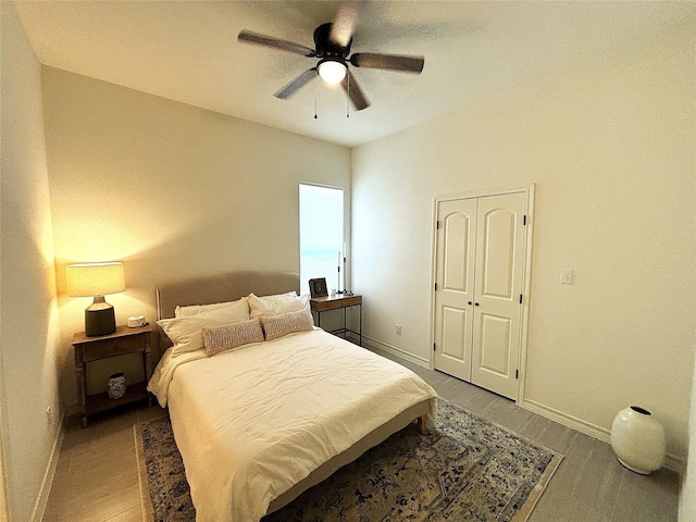 bedroom with baseboards and ceiling fan