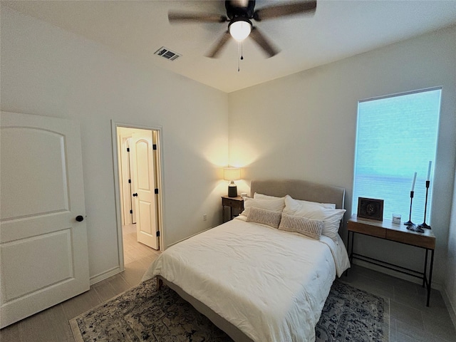 bedroom featuring visible vents and ceiling fan