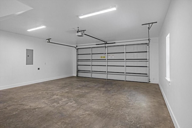 garage with baseboards, a garage door opener, and electric panel