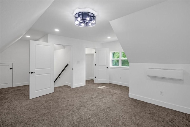 bonus room featuring vaulted ceiling, baseboards, an AC wall unit, carpet flooring, and recessed lighting