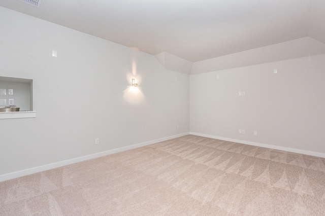 4313 Brookridge Ave, Mckinney, TX 75071 - spare room with baseboards, vaulted ceiling, and light carpet