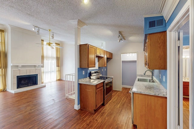 kitchen featuring a sink, ceiling fan, rail lighting, and electric stove