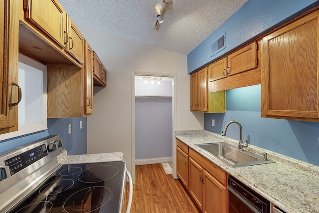kitchen featuring a textured ceiling, light countertops, a sink, stainless steel electric stove, and black dishwasher