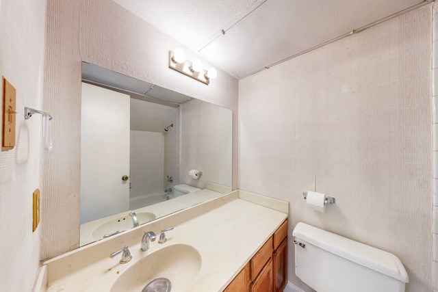 full bath featuring toilet, bathtub / shower combination, and vanity