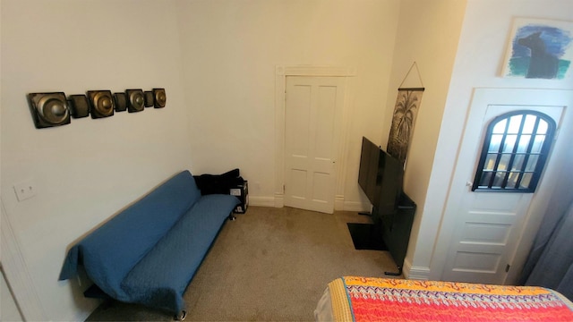 living room featuring baseboards and carpet