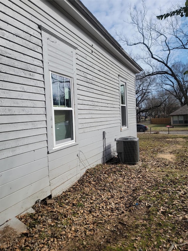 view of side of home featuring central air condition unit