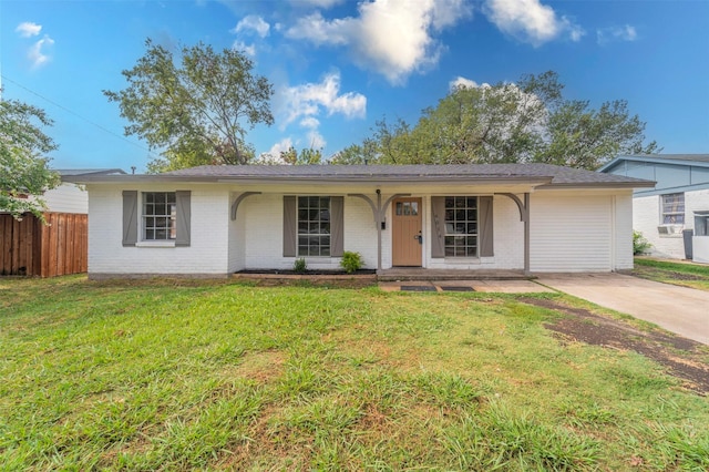 ranch-style home with brick siding, a front lawn, fence, and a porch