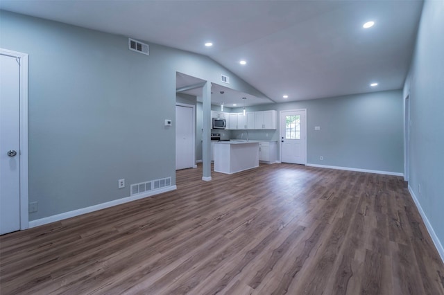 unfurnished living room with recessed lighting, visible vents, lofted ceiling, and dark wood-type flooring
