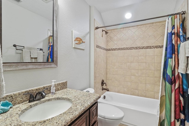bathroom with vanity, a textured wall, toilet, and shower / bath combination with curtain