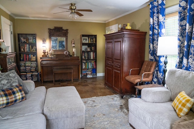 living area featuring crown molding, a ceiling fan, wood finished floors, and a wealth of natural light