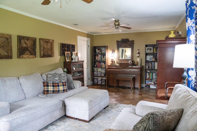 living room with ceiling fan, ornamental molding, and visible vents