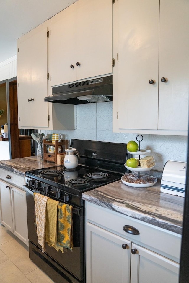 kitchen with decorative backsplash, electric range, under cabinet range hood, and white cabinetry