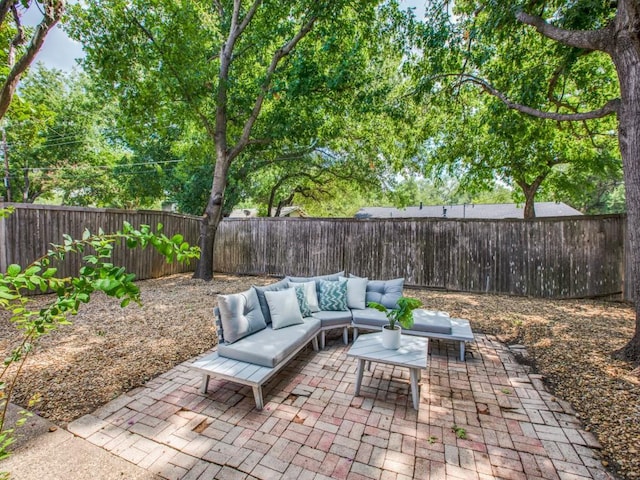 view of patio / terrace featuring a fenced backyard and an outdoor hangout area