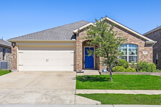 view of front of home with brick siding, a garage, driveway, a front lawn, and roof with shingles