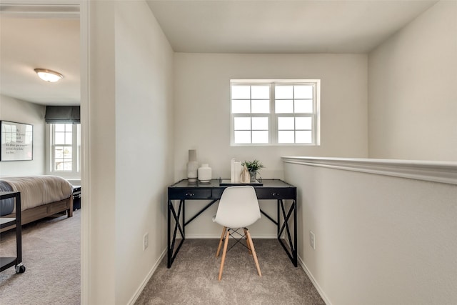 office with baseboards and carpet flooring