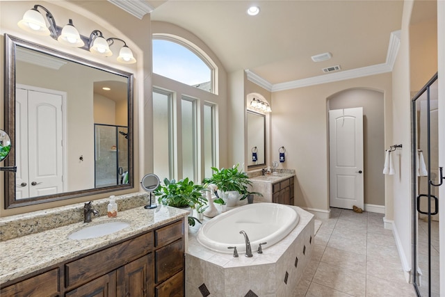 5916 River Highlands Dr, Mckinney, TX 75070 - full bathroom featuring a shower stall, a garden tub, crown molding, two vanities, and tile patterned flooring
