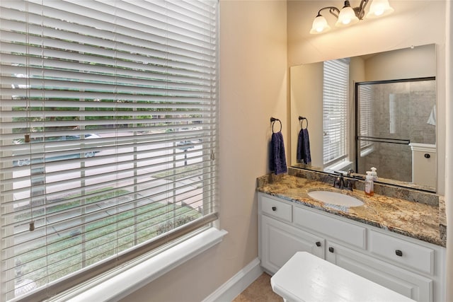 5916 River Highlands Dr, Mckinney, TX 75070 - bathroom with baseboards, vanity, and a shower
