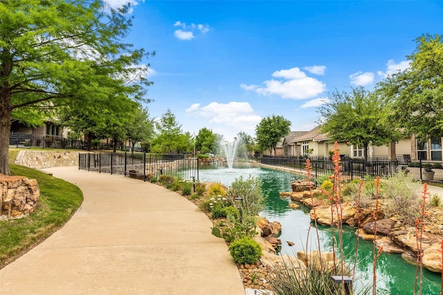 5916 River Highlands Dr, Mckinney, TX 75070 - view of property's community featuring fence and a small pond