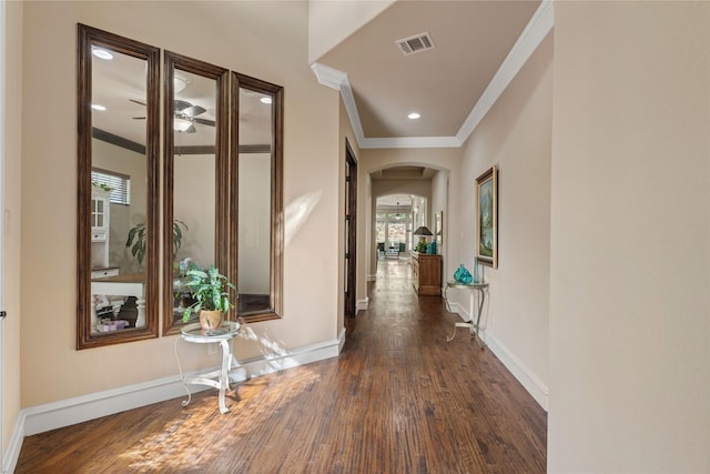 5916 River Highlands Dr, Mckinney, TX 75070 - corridor with crown molding, arched walkways, dark wood finished floors, baseboards, and recessed lighting