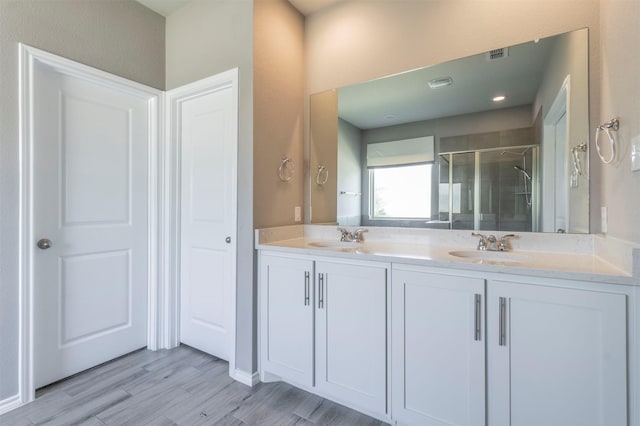1800 Emilia Dr, Celina, TX 75009 - full bath featuring a stall shower, double vanity, and wood finished floors