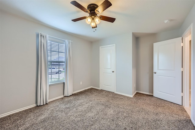 unfurnished bedroom featuring baseboards, ceiling fan, and carpet flooring