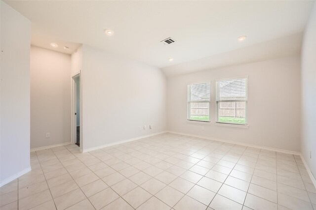 empty room featuring baseboards, recessed lighting, light tile patterned flooring, and visible vents
