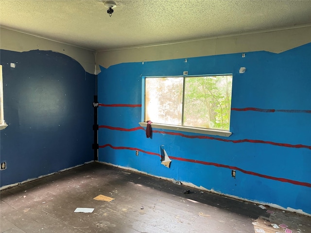 spare room featuring a textured ceiling