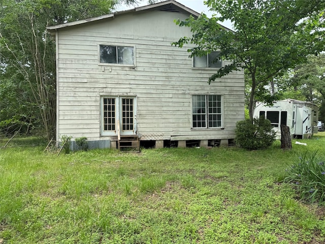 rear view of house with entry steps