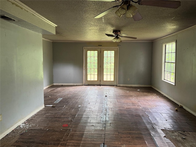 unfurnished room featuring wood-type flooring, a ceiling fan, crown molding, and visible vents
