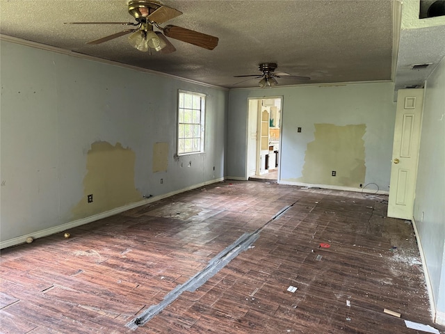 unfurnished room with ceiling fan, a textured ceiling, baseboards, wood finished floors, and ornamental molding