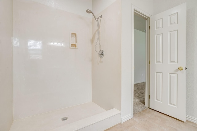 full bathroom featuring walk in shower and tile patterned flooring
