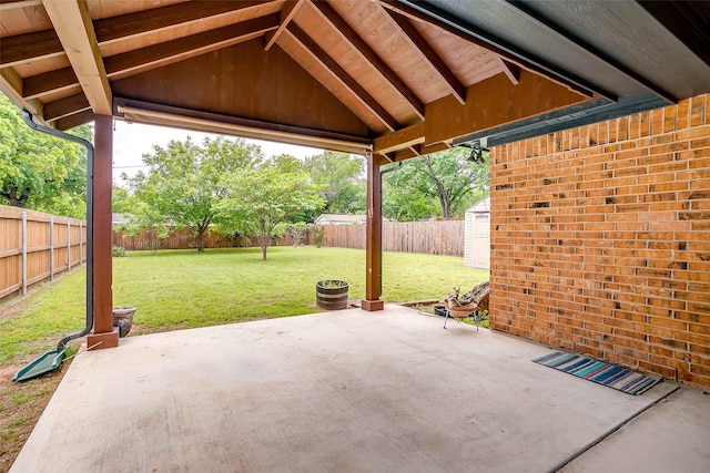 view of patio / terrace featuring a fenced backyard and a storage unit