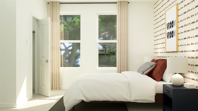carpeted bedroom with baseboards