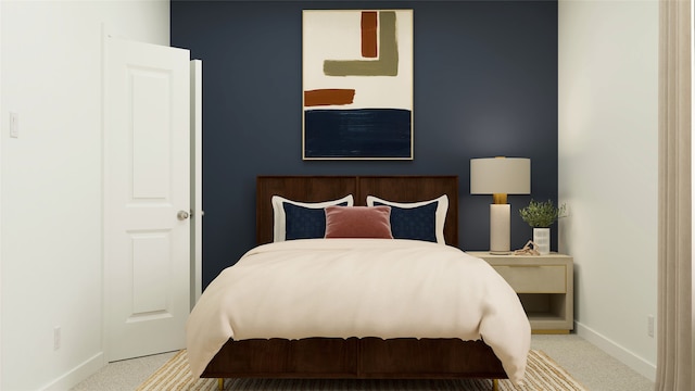 bedroom featuring baseboards and carpet