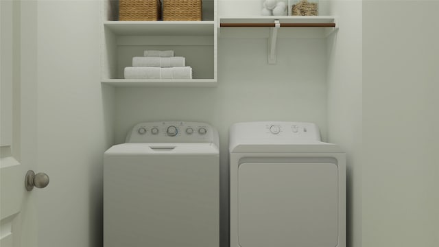 clothes washing area with laundry area and washer and clothes dryer