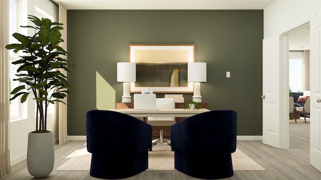 home office with baseboards and wood finished floors