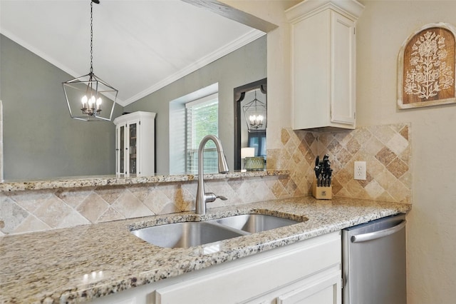 kitchen with a sink, an inviting chandelier, ornamental molding, and dishwasher