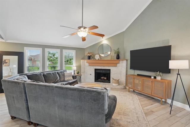 living room featuring crown molding, ceiling fan, a brick fireplace, and wood finished floors