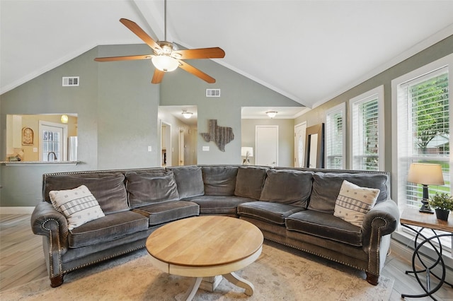 living room featuring ornamental molding, a ceiling fan, wood finished floors, and visible vents