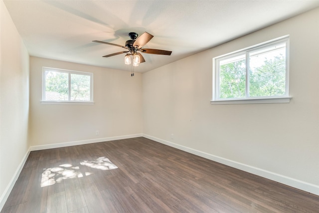 2223 Foxcroft Cir, Denton, TX 76209 - spare room with a ceiling fan, baseboards, dark wood finished floors, and a wealth of natural light