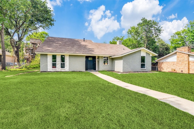 2223 Foxcroft Cir, Denton, TX 76209 - ranch-style house with fence, roof with shingles, brick siding, and a front yard