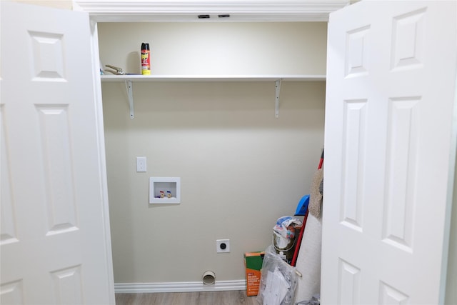 laundry area featuring laundry area, hookup for a washing machine, baseboards, electric dryer hookup, and wood finished floors