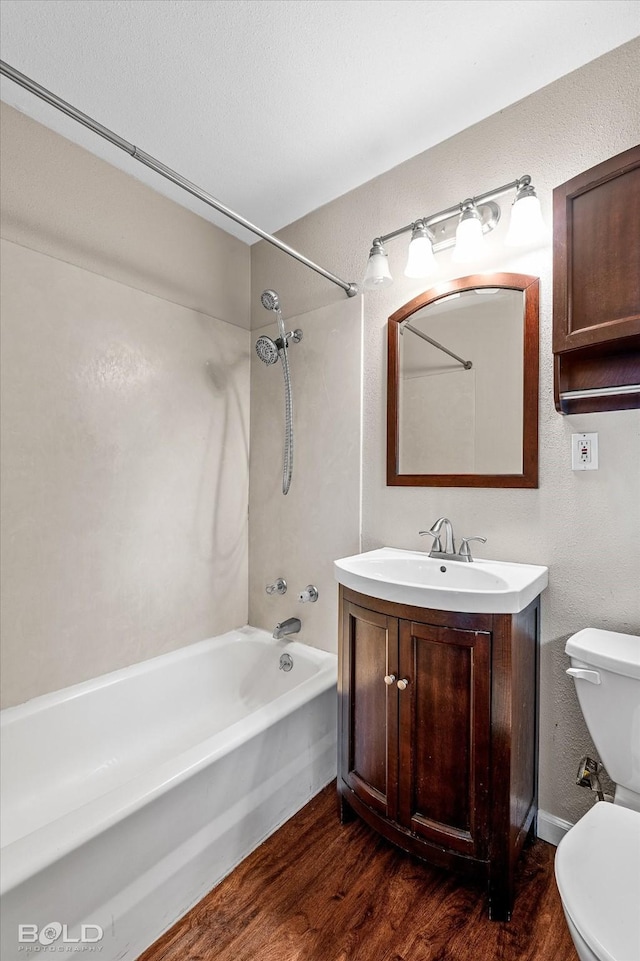 230 Peyton Colquitt Pl, Shreveport, LA 71115 - full bath with vanity, a textured wall, wood finished floors, toilet, and shower / washtub combination