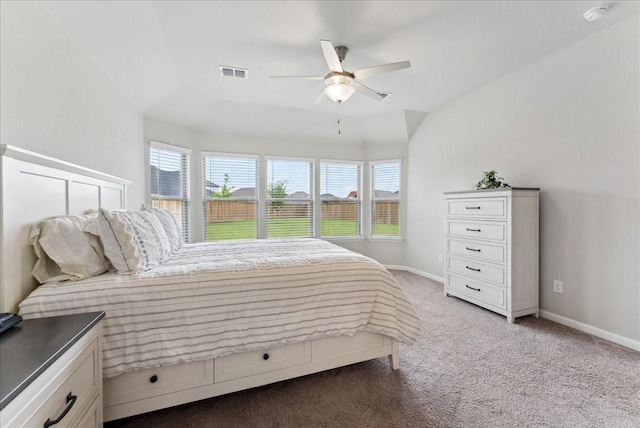 carpeted bedroom with visible vents, baseboards, and ceiling fan
