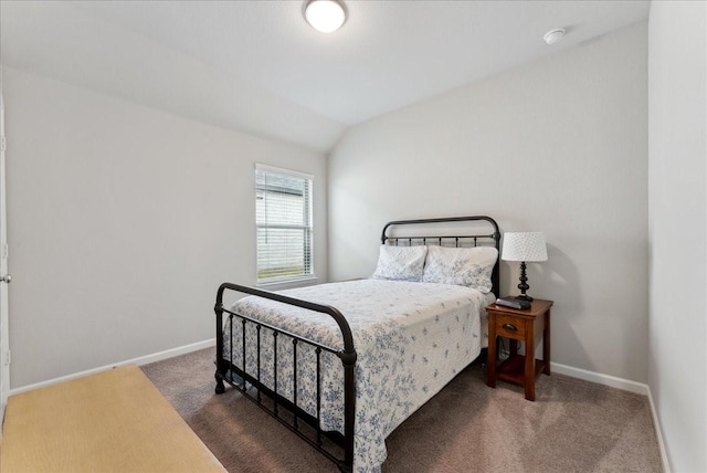 bedroom with baseboards, carpet, and lofted ceiling