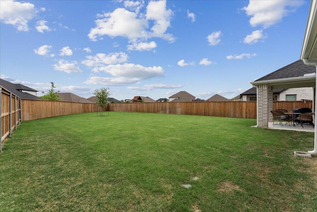 view of yard featuring a patio and a fenced backyard