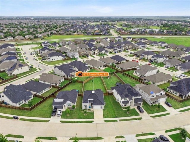 birds eye view of property with a residential view