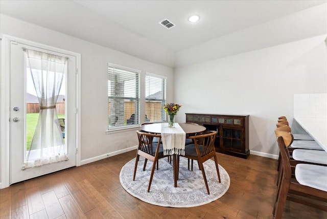 dining area featuring recessed lighting, baseboards, wood finished floors, vaulted ceiling, and visible vents
