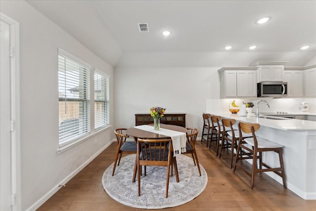 dining area with visible vents, recessed lighting, baseboards, and wood finished floors